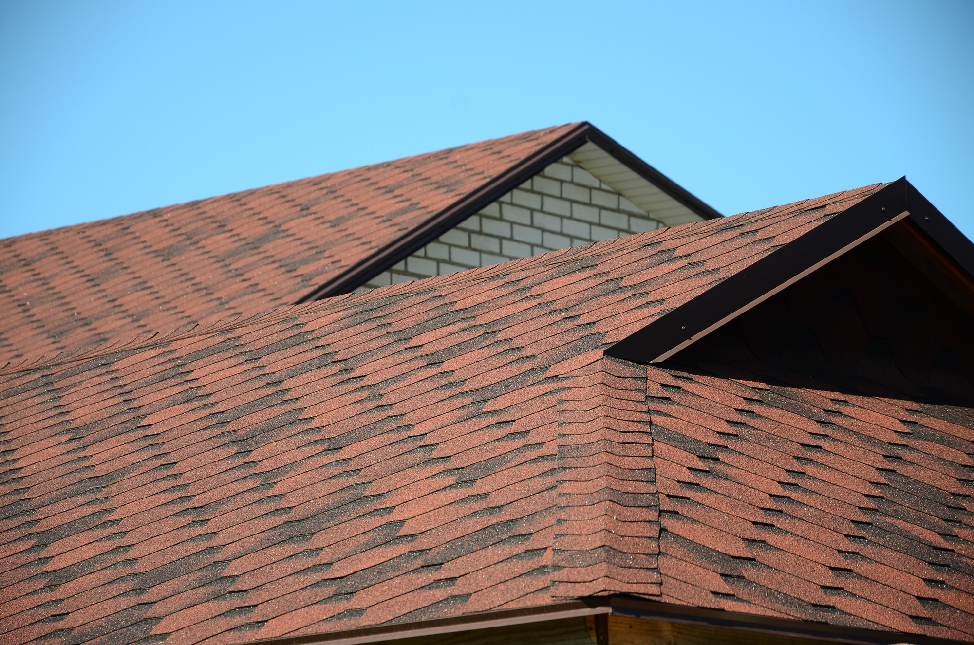 the-roof-is-covered-with-bituminous-shingles-of-brown-color-quality-roofing